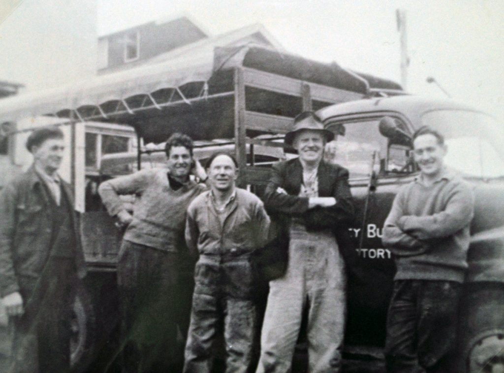 Romsey butter factory workers standing next to a van.